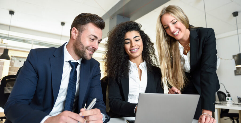 aamulti ethnic group three businesspeople meeting modern office two women man wearing suit looking laptop computer